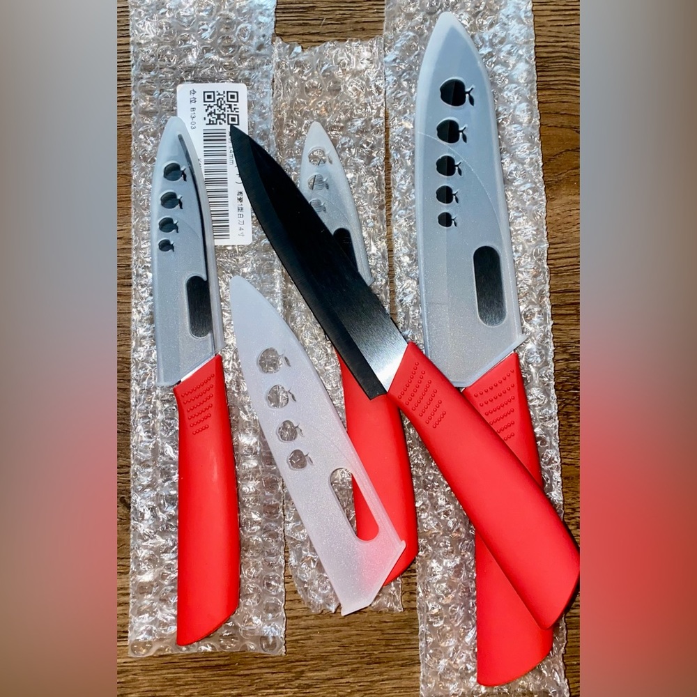 NWT CERAMIC SOLID ZIRCON KITCHEN KNIFE SET OF FOUR RED BLACK NEVER NEEDS SHARPND